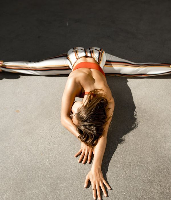 Woman in a calm yoga pose, focusing on inner balance and core strength.